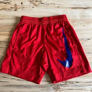 Nike Dri-Fit boys red shorts with blue swish - size 4